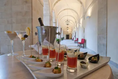 a tray with drinks and appetizers on a table at Parador de Corias in Cangas del Narcea