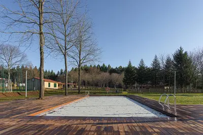 a basketball court in the middle of a park at TEIRABOA BASE CAMP in Arzúa