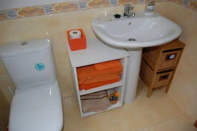 a small bathroom with a sink and a toilet at La Casa de Lines in Monforte de Lemos