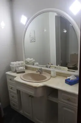 a bathroom with a sink and a large mirror at El piso de Manuela VUT-CO-004057 in Padrón