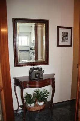 a table with a mirror and a camera on it at El piso de Manuela VUT-CO-004057 in Padrón