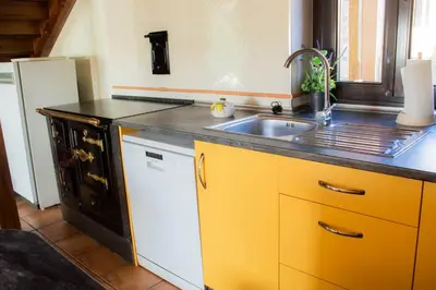 a kitchen with a sink and a counter top at Casa Valdequiruelo in Vanidodes