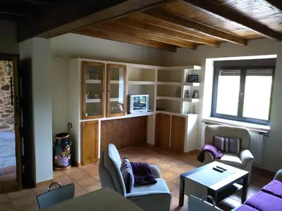 a living room with a couch and a table at Casa Valdequiruelo in Vanidodes