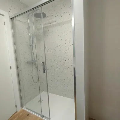 a shower with a glass door in a bathroom at CARMELA in Santiago de Compostela