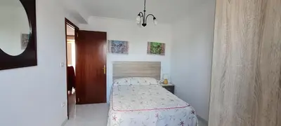 a bedroom with a bed in a white room at Casa entera en Nois-Foz in Nois