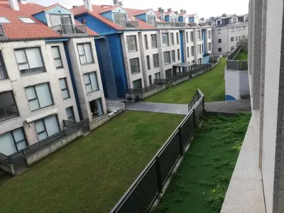 a view from the balcony of a row of buildings at Pintoresco piso a 5 min de la playa wifi/Netflix in Ares