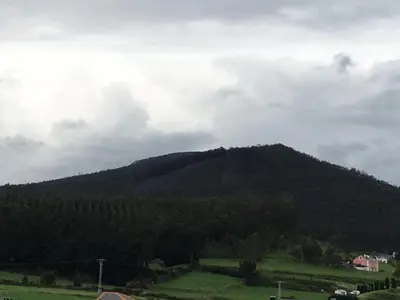 a mountain in the middle of a field at Villa De Foz in Foz