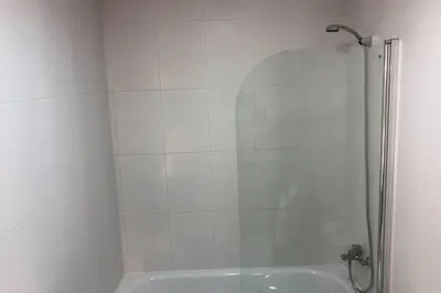 a shower with a glass door in a bathroom at Destino Deluxe Mariña in Viveiro