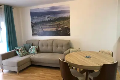 a living room with a couch and a table at Destino Deluxe Mariña in Viveiro