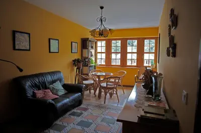 a living room with a couch and a table at La Rectoral de San Juan in El Franco