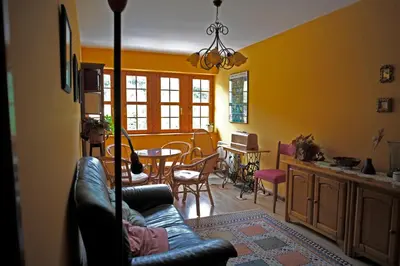 a living room with a couch and a table at La Rectoral de San Juan in El Franco