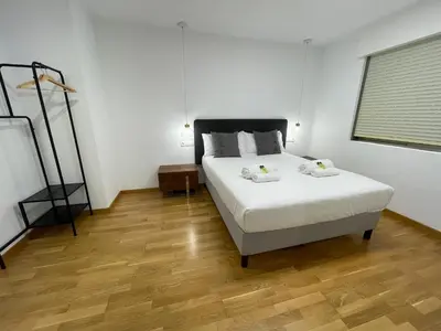 a bedroom with a bed with two towels on it at Oktheway Pedro Saco Street in Sarria