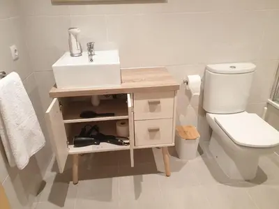 a white bathroom with a sink and a toilet at Slow House Sarria in Sarria