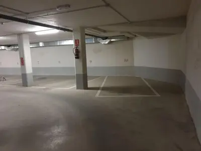 an empty parking lot in an empty parking garage at Slow House Sarria in Sarria