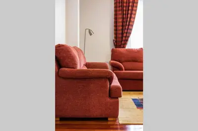 a living room with a couch and a chair at APARTAMENTO EN A ESTRADA/GALICIA in A Estrada