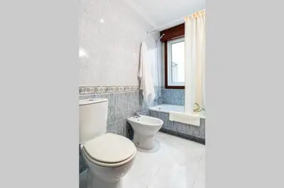 a bathroom with a toilet and a tub and a sink at APARTAMENTO EN A ESTRADA/GALICIA in A Estrada