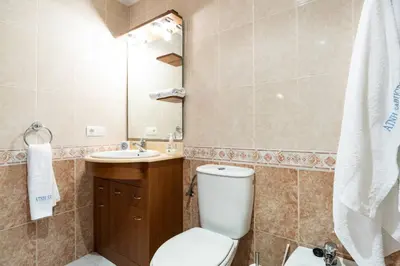 a bathroom with a toilet and a sink at APARTAMENTO EN A ESTRADA/GALICIA in A Estrada