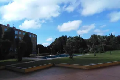 a view of a park with a building and trees at APARTAMENTO EN A ESTRADA/GALICIA in A Estrada