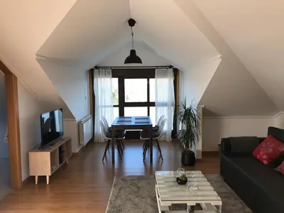 a living room with a couch and a table at APARTAMENTO MANUEL MARIA in Allariz