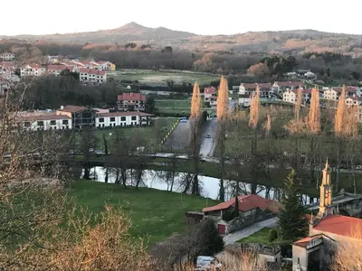 a view of a town with a river and buildings at APARTAMENTO MANUEL MARIA in Allariz
