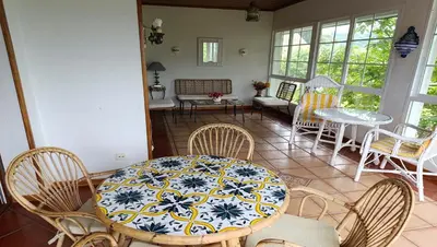 a dining room with a table and chairs and a table and chairsktop at Casa independiente para grandes grupos y familias in Valeije