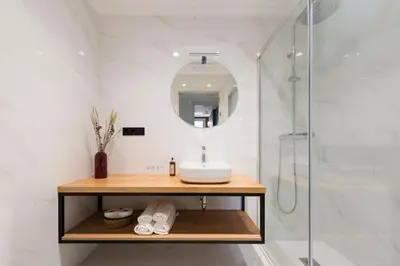 a bathroom with a sink and a glass shower at Hotel Rías Altas in Barreiros