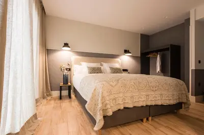 a bedroom with a large bed in a room at Hotel Rías Altas in Barreiros