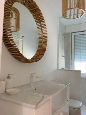 a bathroom with a sink and a mirror at Oktheway Perbes Beach in Boebre