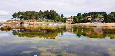 a large body of water with a beach and houses at Oktheway Perbes Beach in Boebre