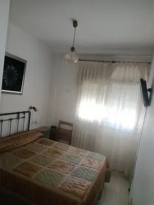 a bedroom with a bed and a window at Gran Vía in Lugo