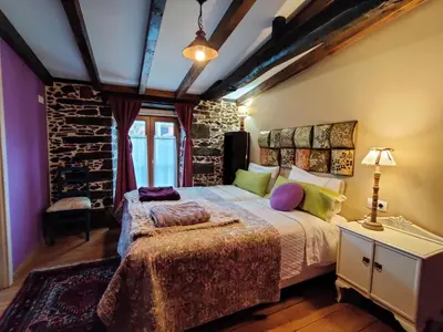 a bedroom with a large bed in a room at Casa do Estevo in Francos