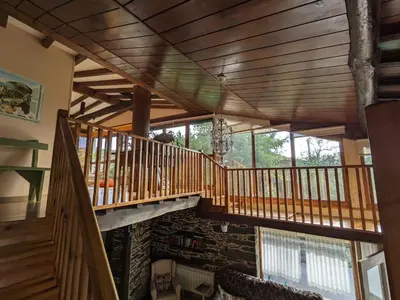 a room with a wooden staircase in a house at Casa do Estevo in Francos