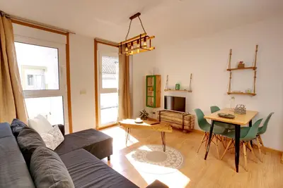 a living room with a couch and a table at VM Apartamentos Turísticos in Santiago de Compostela