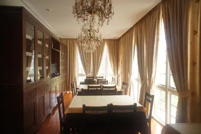 a dining room with a table and chairs and a chandelier at Mirador Da Ribeira in Viana do Bolo