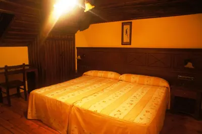 a bedroom with a large bed in a room at Mirador Da Ribeira in Viana do Bolo