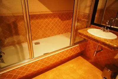 a bathroom with a shower and a sink at Mirador Da Ribeira in Viana do Bolo