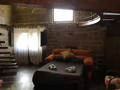 a room with a bed and a window and a window at Ribeira sacra ourense in Ourense