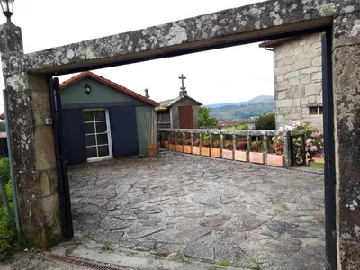 an entrance to a house with a stone patio at Casa Camino Santiago-Fisterra in Amés