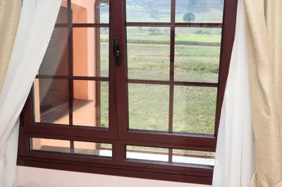 a window with a view of a field at Hotel Restaurante Casa Pipo in Tuña