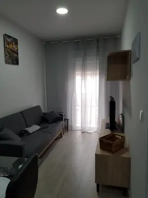 a living room with a couch and a table at A casa de Mateo in Ribadavia