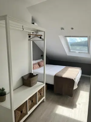 a bedroom with a bunk bed and a window at CONCHEIROS 5 APARTAMENTOS TURISTICOS in Santiago de Compostela
