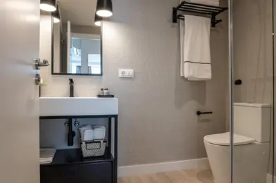 a bathroom with a sink and a toilet at CONCHEIROS 5 APARTAMENTOS TURISTICOS in Santiago de Compostela