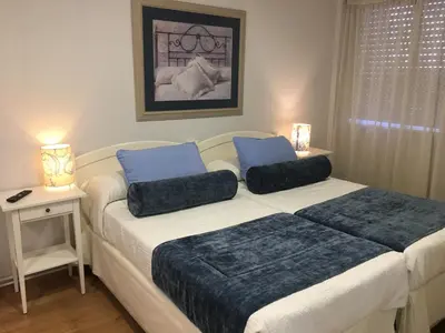 a bedroom with a bed with two pillows on it at Hostal Restaurante Alarico in Allariz