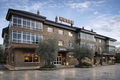 a hotel building with a sign on top of it at Hotel San Rosendo in Ourense