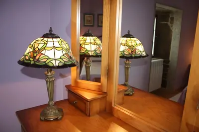 two lamps sitting on a table in front of a mirror at Casa Galipendre in A Estrada