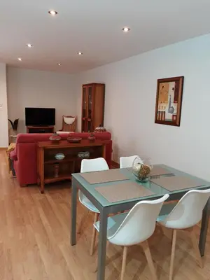 a living room with a table and a couch at Casa Galipendre in A Estrada