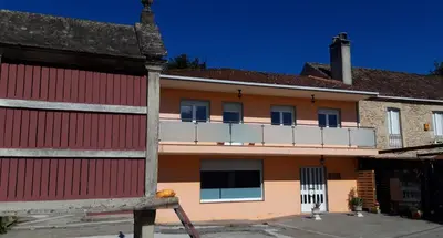 a building with a balcony on top of it at Casa Manola in Teo
