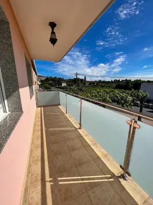 a balcony of a house with a view of the water at Casa Manola in Teo