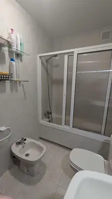 a bathroom with a shower and a toilet and a sink at Alojamiento Camiño Real in Sigüeiro