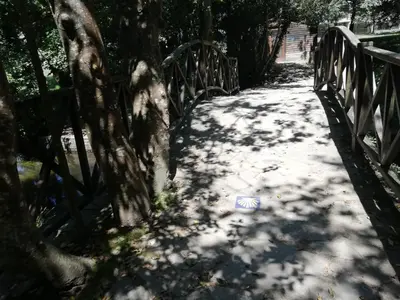 a path with a fence and trees on it at Alojamiento Camiño Real in Sigüeiro